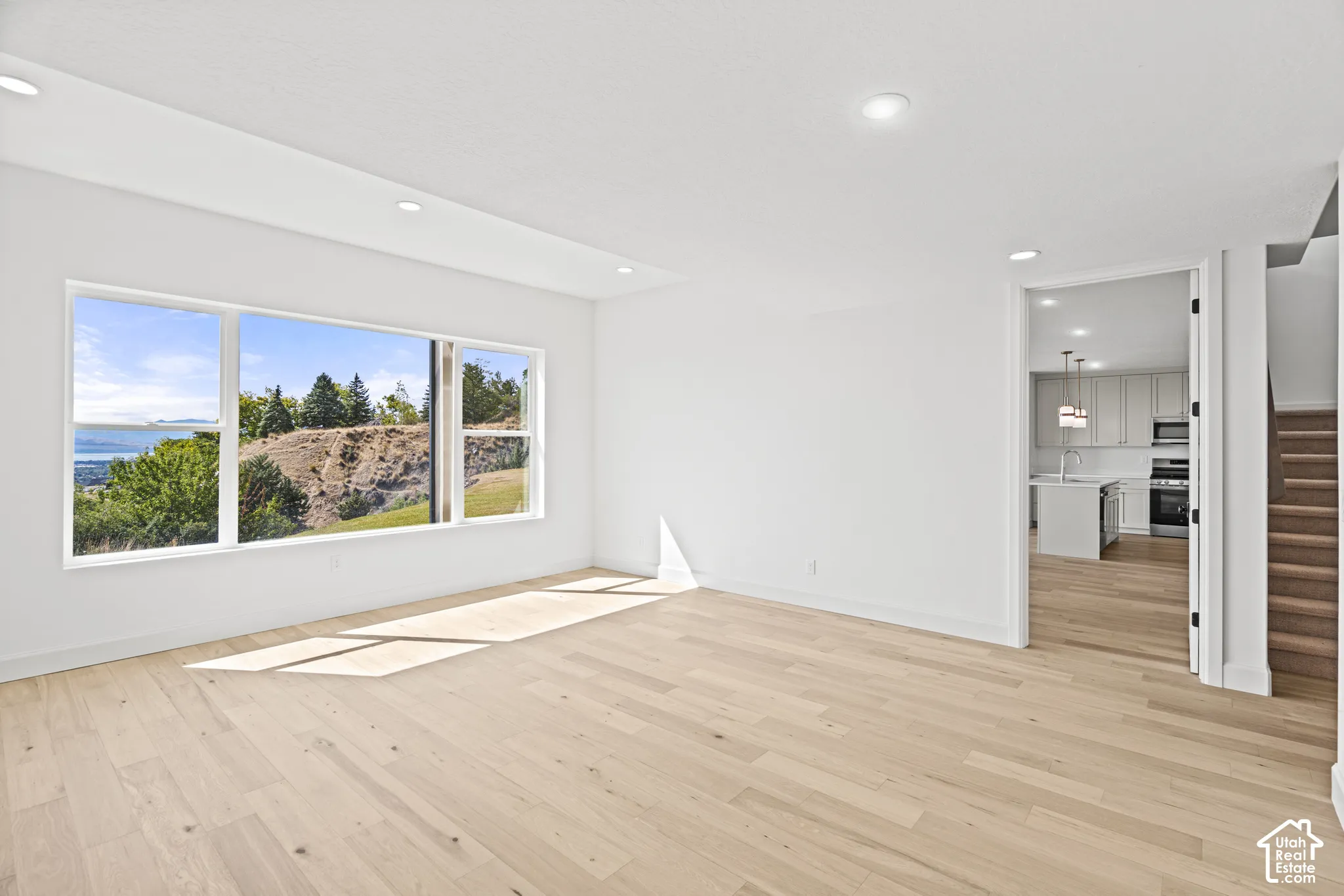 Expansive window offering a distant water and landscape backdrop