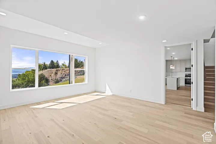 Expansive window offering a distant water and landscape backdrop