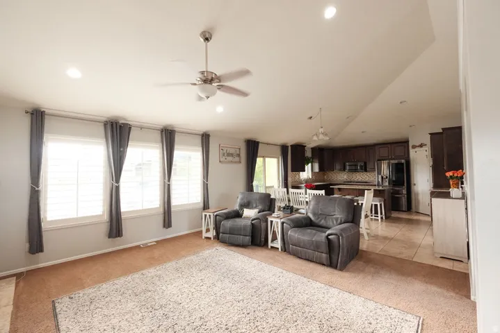 Recessed lighting, ceiling fan, three pane windows, wood-finish cabinetry, tile flooring