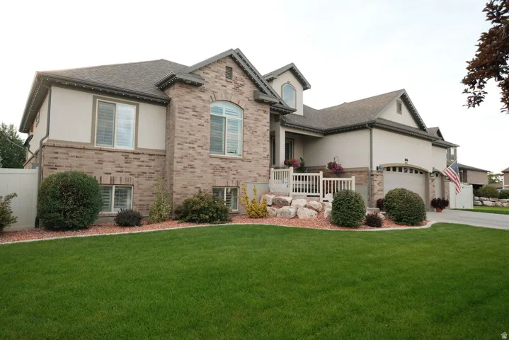 Brick and stucco exterior with multiple gables