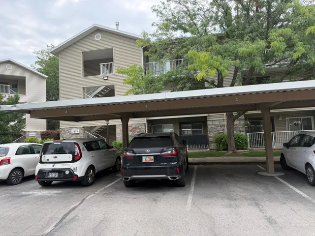 Covered parking structure with designated spaces