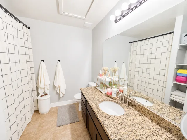 Double vanity with granite countertop and undermount sinks