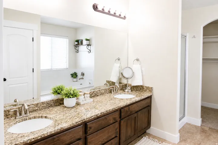 Dual vanity with granite countertop and undermount sinks
