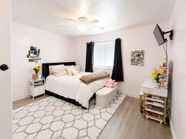 Recessed window with blinds and dark-toned curtains