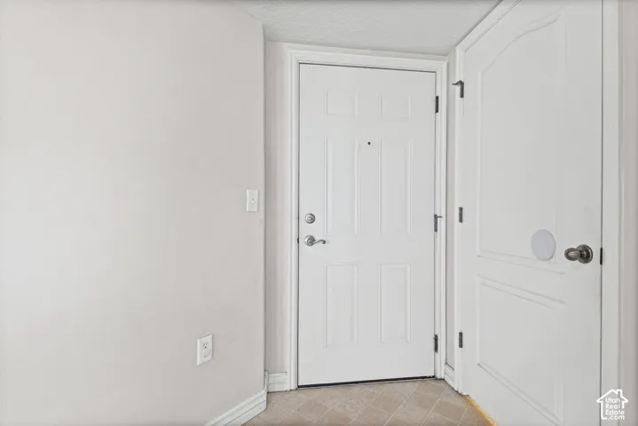 White paneled door with brushed nickel hardware