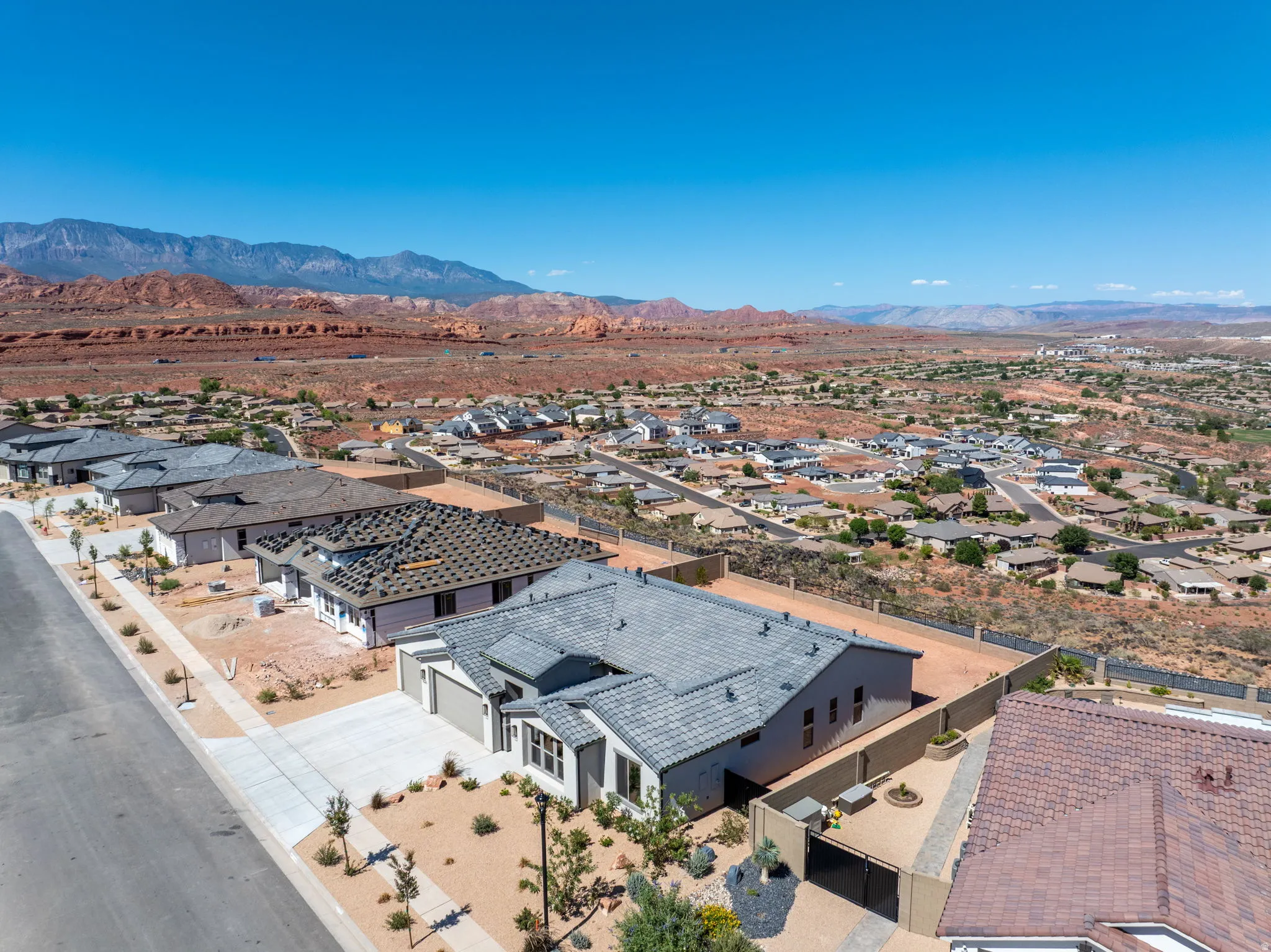 Expansive residential community , new construction properties, and desert landscaping