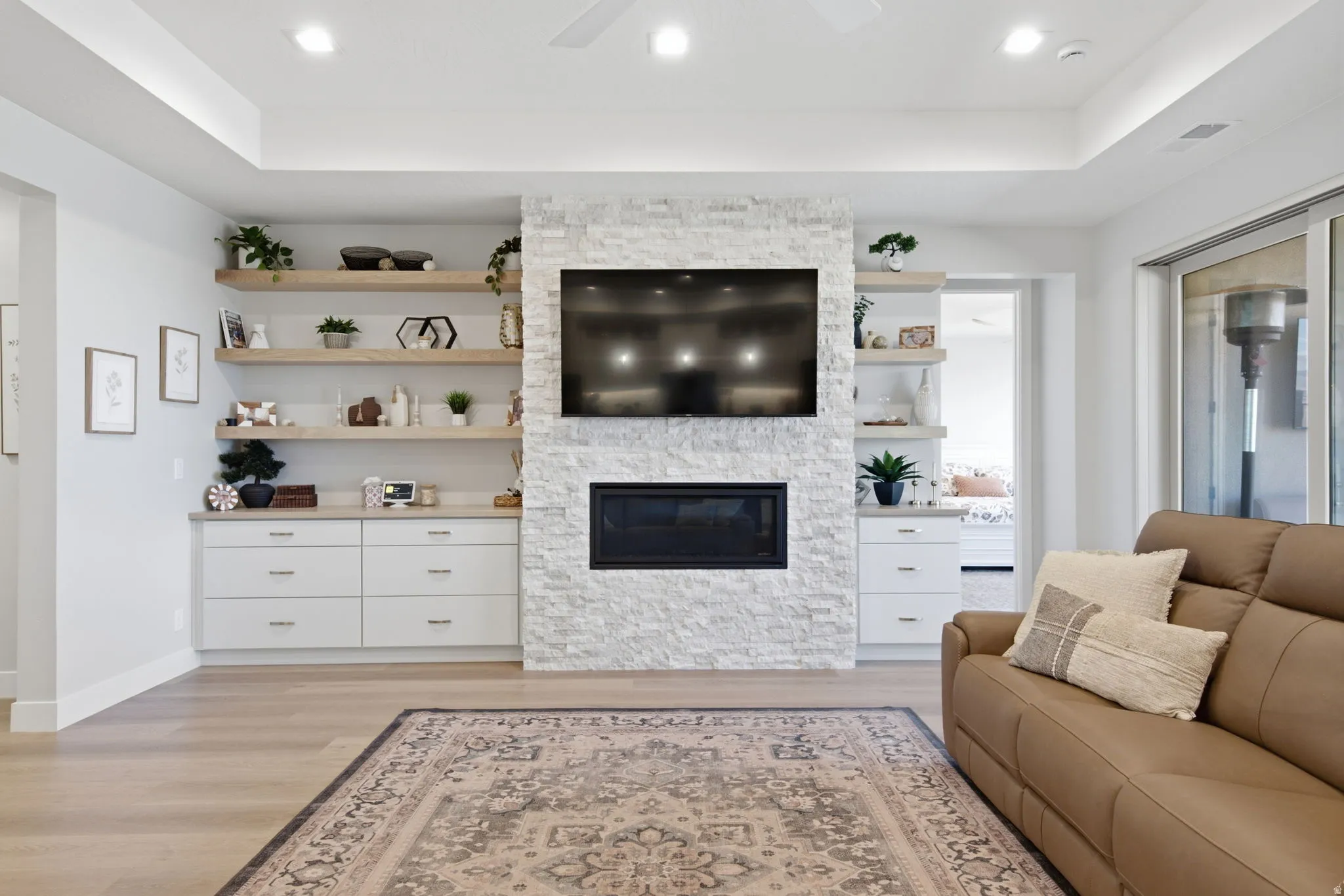 Stone-clad fireplace with an integrated modern electric insert