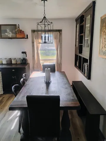Wood-finish flooring with a rustic dining table