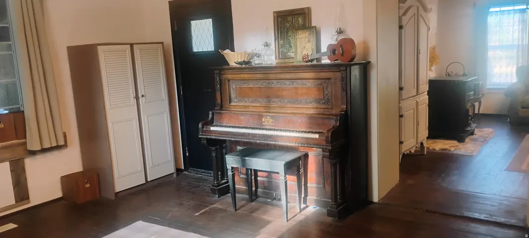 Dark wood-finish flooring throughout