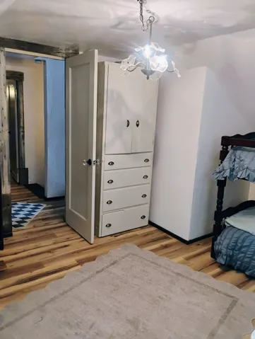 Wood-finish flooring with a decorative area rug