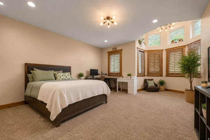 Warm-toned walls with recessed lighting (AI staged-structure and integrity not changed)