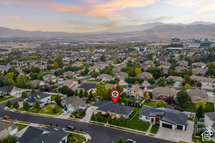 Expansive neighborhood setting with mature trees and paved streets