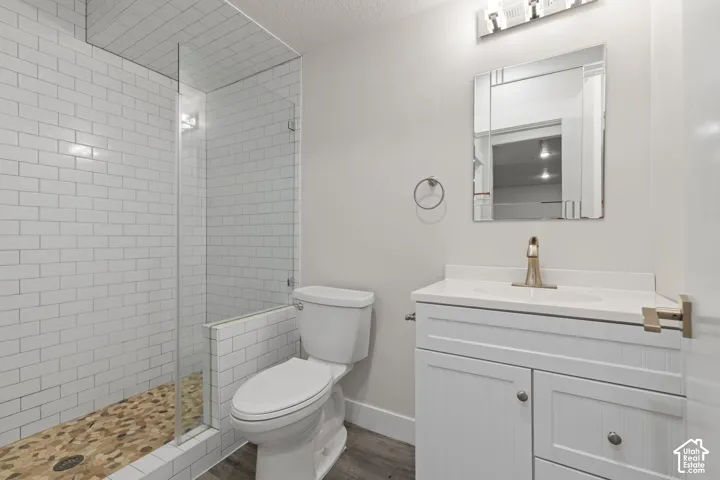 Walk-in shower with subway tile surround and pebble flooring
