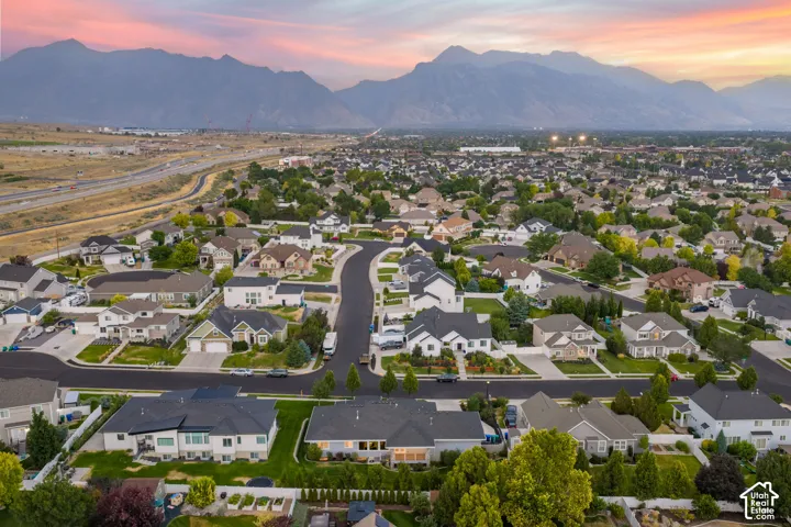 Expansive residential neighborhood with mature landscaping and mountain backdrop