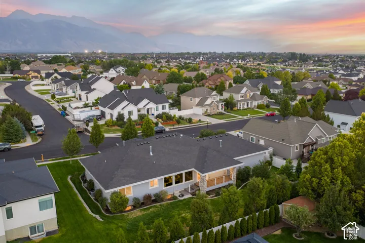 Residential neighborhood featuring a curvilinear street design and abundant mature trees