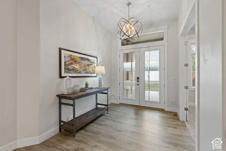 Double-door entry with transom window and glass panels