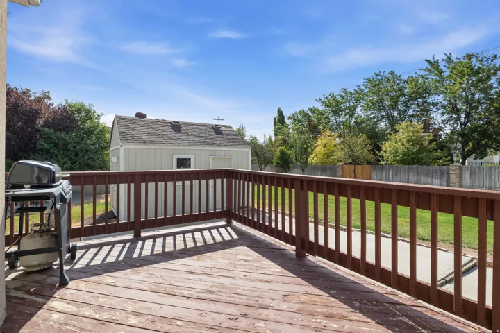 Wood-finish deck with a perimeter railing