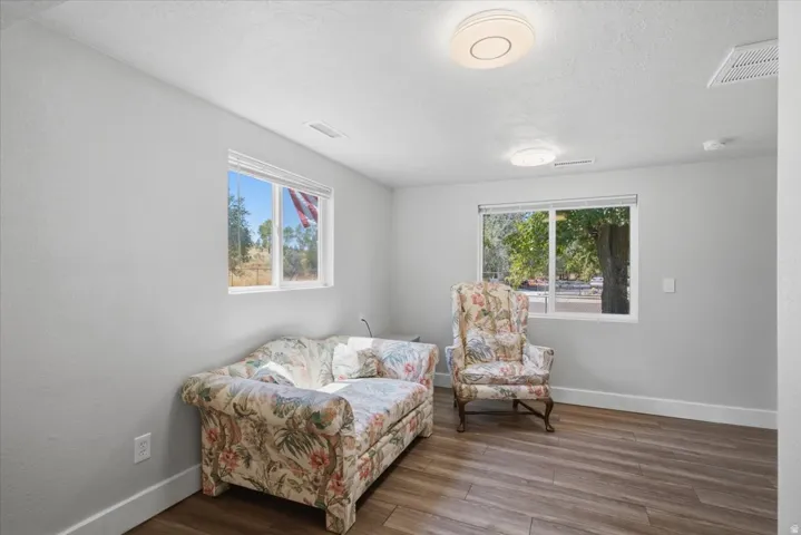 Bright living room with views looking out to North Fort Disc Golf Course/Observatory Park