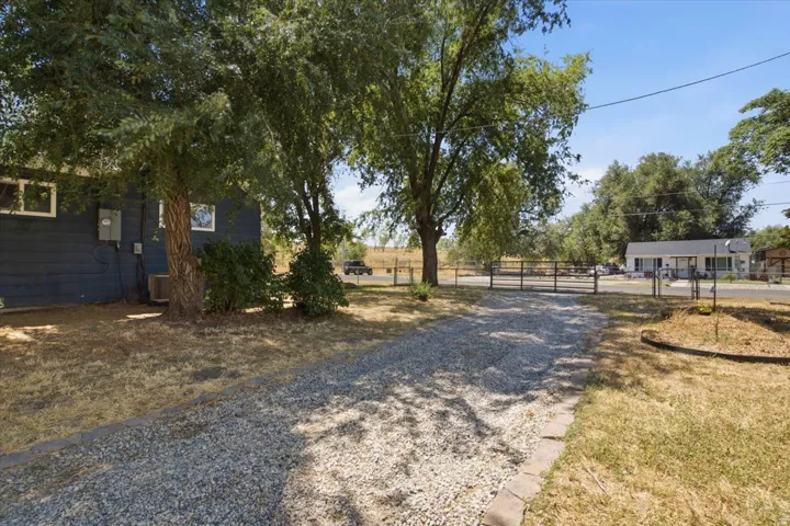 Second driveway, gravel. Can fit 36 ft RV with pull through option to main driveway