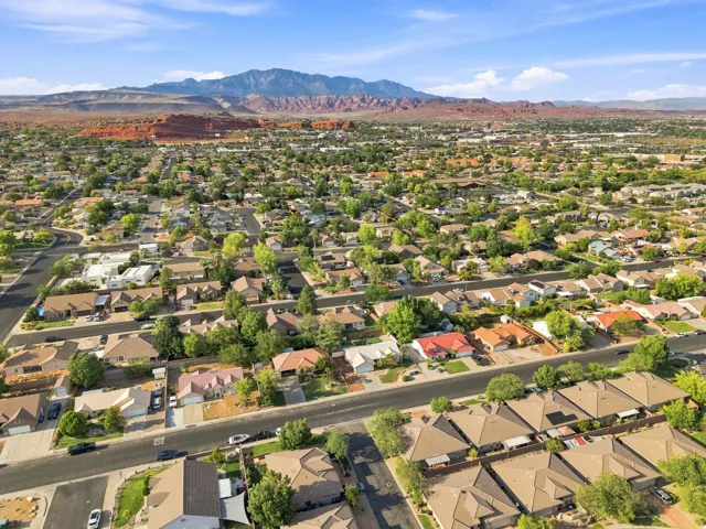 Expansive residential area with numerous single-family homes, mature landscaping, and paved streets