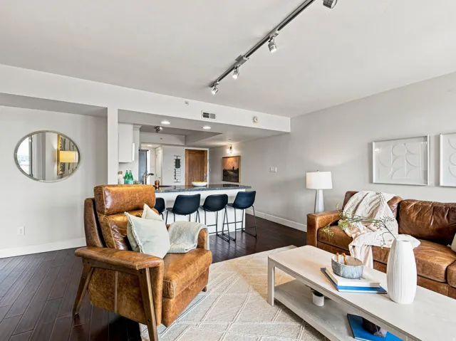 Dark wood-finish flooring complements light wall tones throughout