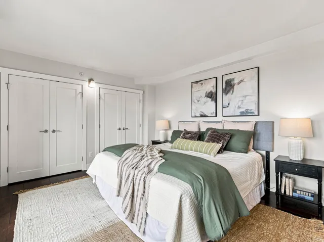 Dark wood-finish flooring with white walls