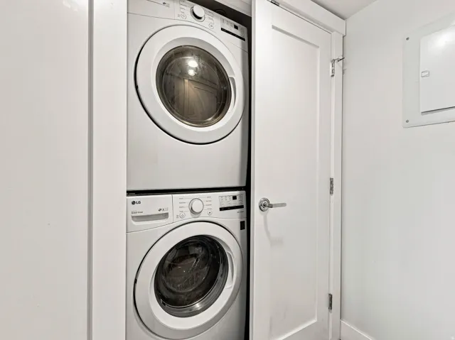 Stackable washer and dryer unit within a dedicated closet