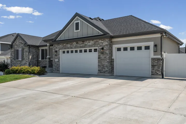 Exterior featuring stone veneer and stucco siding