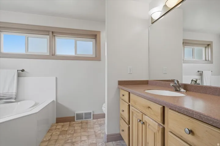 Integrated vanity with a single basin sink and ample storage