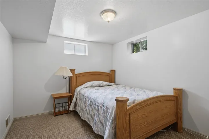 Recessed ceiling light fixture and two upper wall windows
