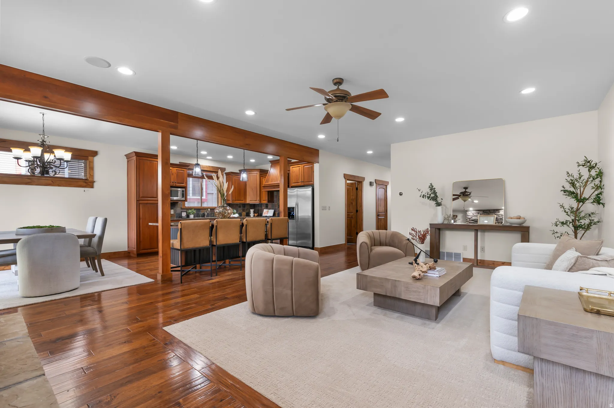 Wood-finish flooring throughout, recessed lighting, and a ceiling fan