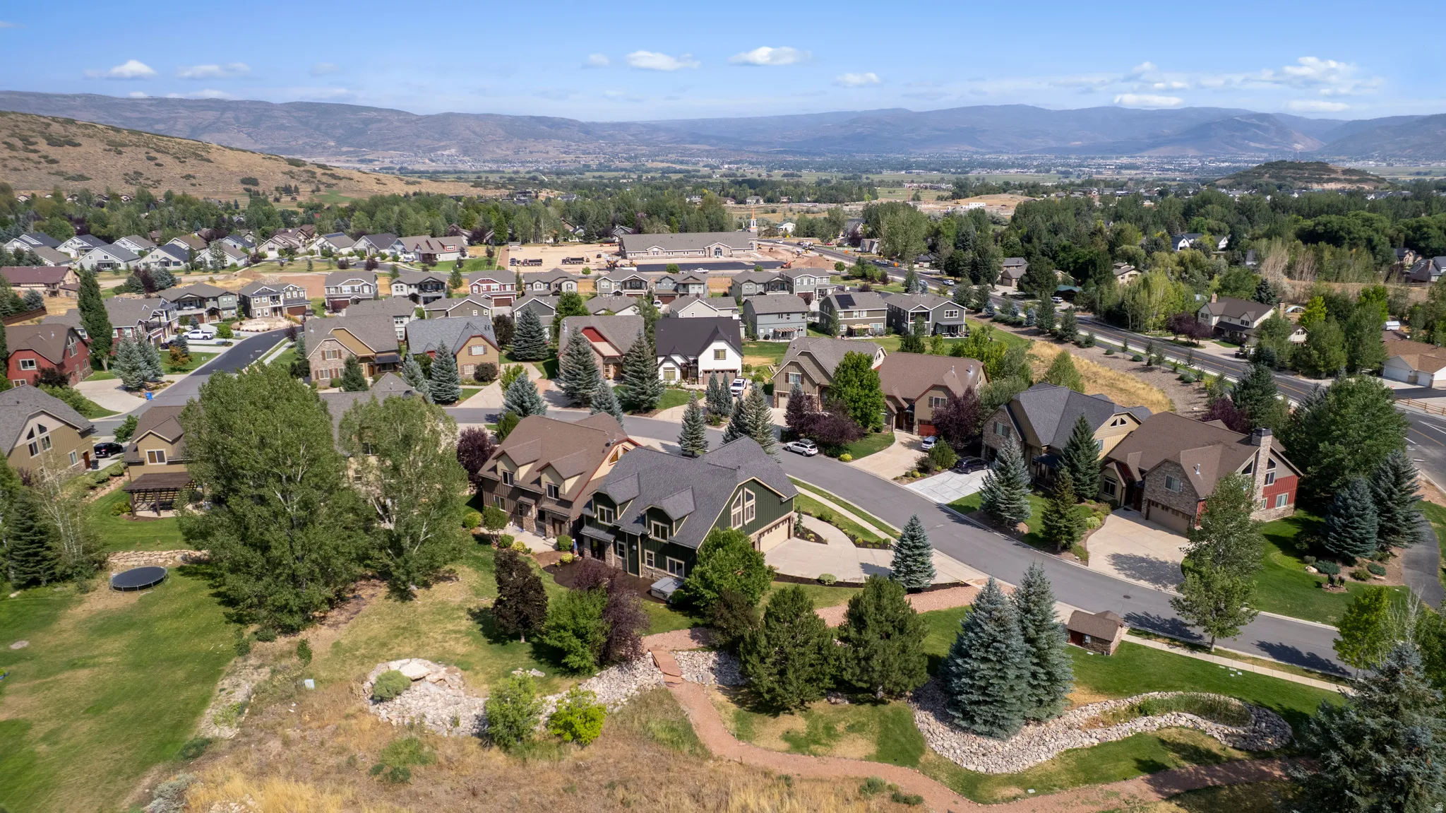 Residential neighborhood with varied architectural styles and mature landscaping
