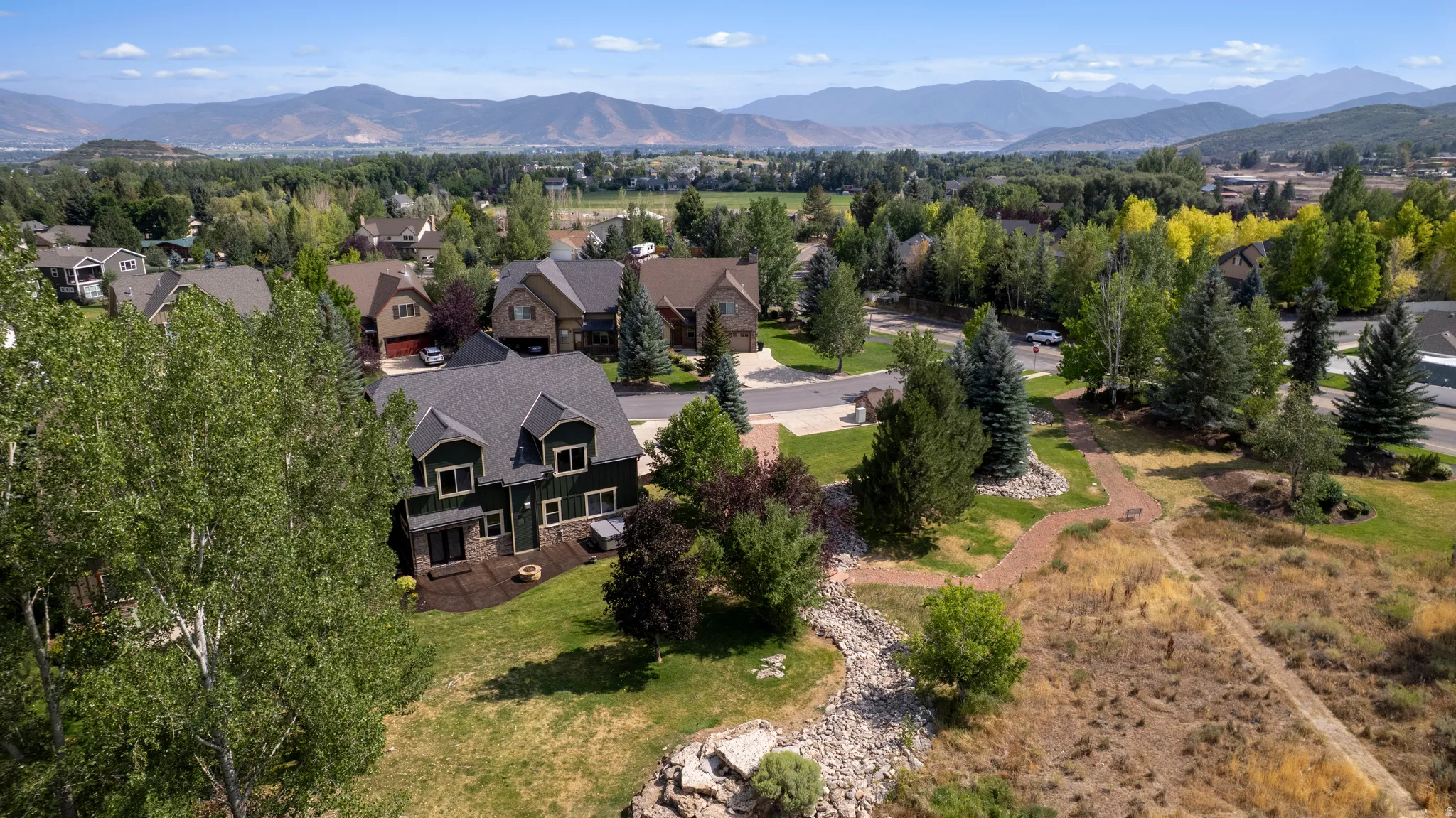 Neighborhood setting with established residential properties and natural landscaping