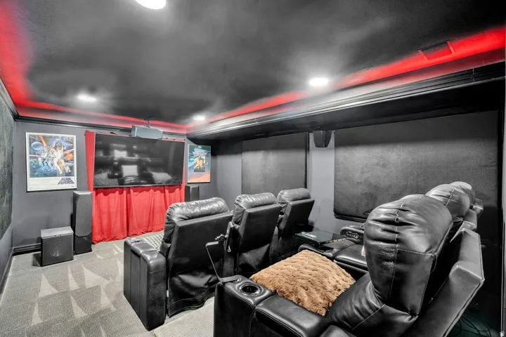 Dedicated media room featuring recessed lighting, accent lighting, a large screen, and acoustic wall panels