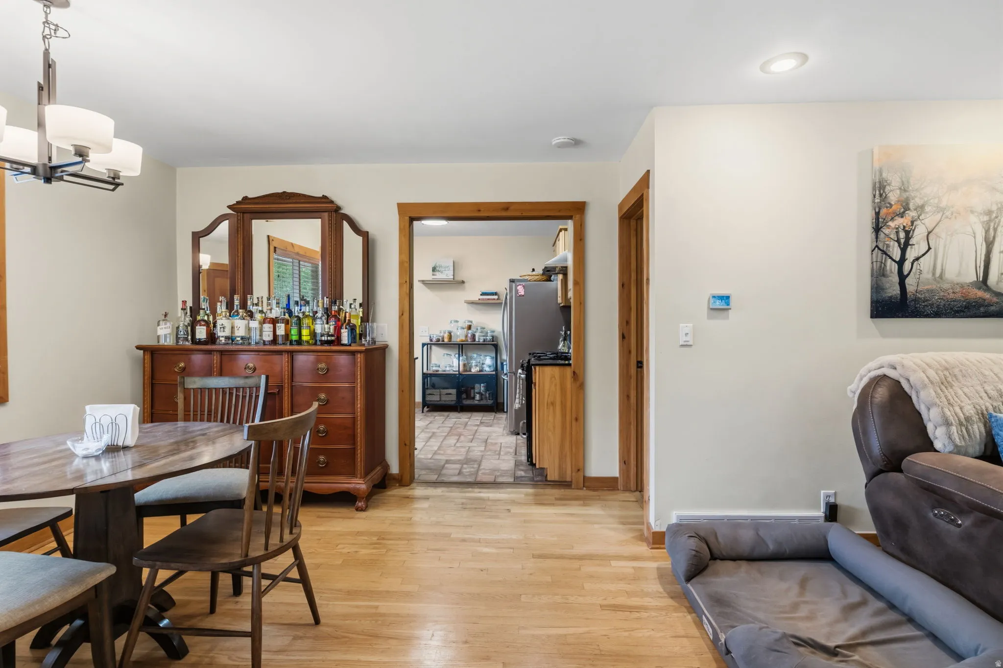 Hardwood flooring throughout, recessed ceiling lighting, and natural wood trim