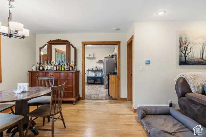 Hardwood flooring throughout, recessed ceiling lighting, and natural wood trim