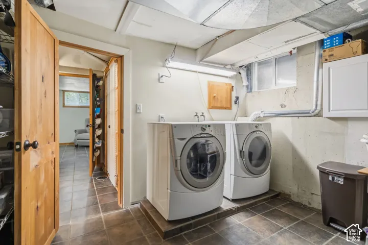 Tile flooring with contrasting grout, recessed window, and exposed ductwork