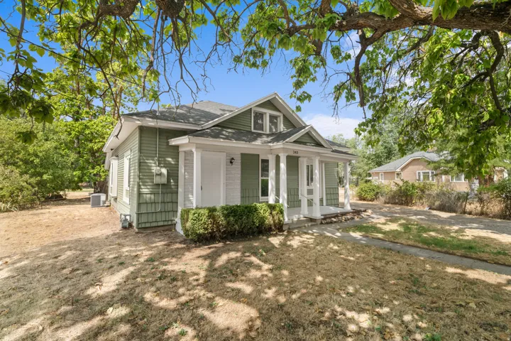Green siding exterior with white trim
