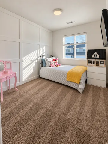 White paneled accent wall, brown carpeting, recessed window with blinds, and flush-mount ceiling light