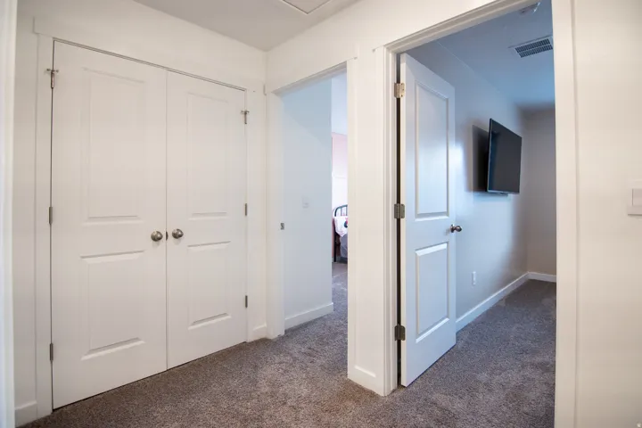 White paneled doors with brushed nickel hardware