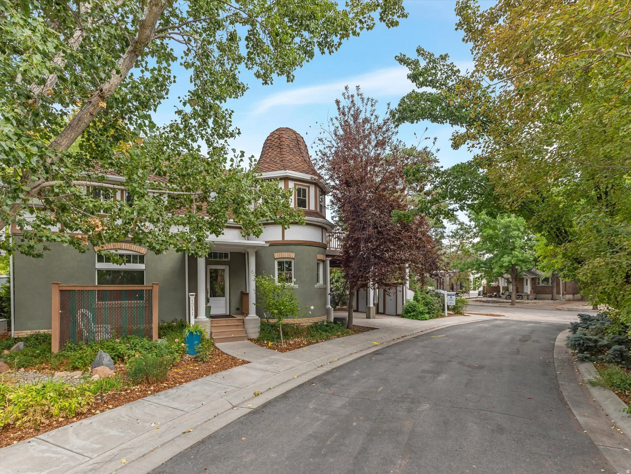 Turreted architecture with a conical roof and decorative trim