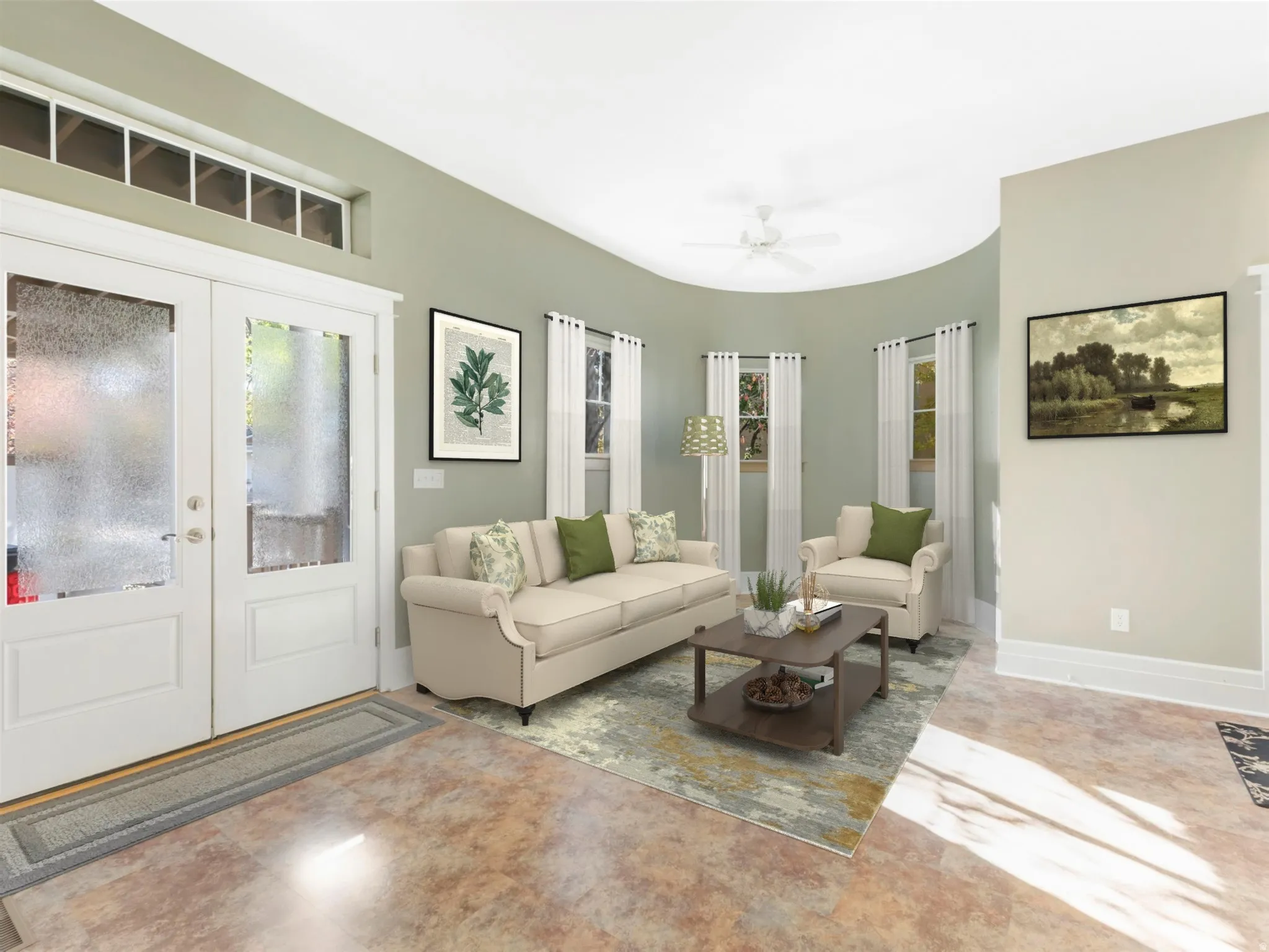 Double entry doors with transom windows, curved wall architecture, multiple windows with white trim, ceiling fan, and durable flooring