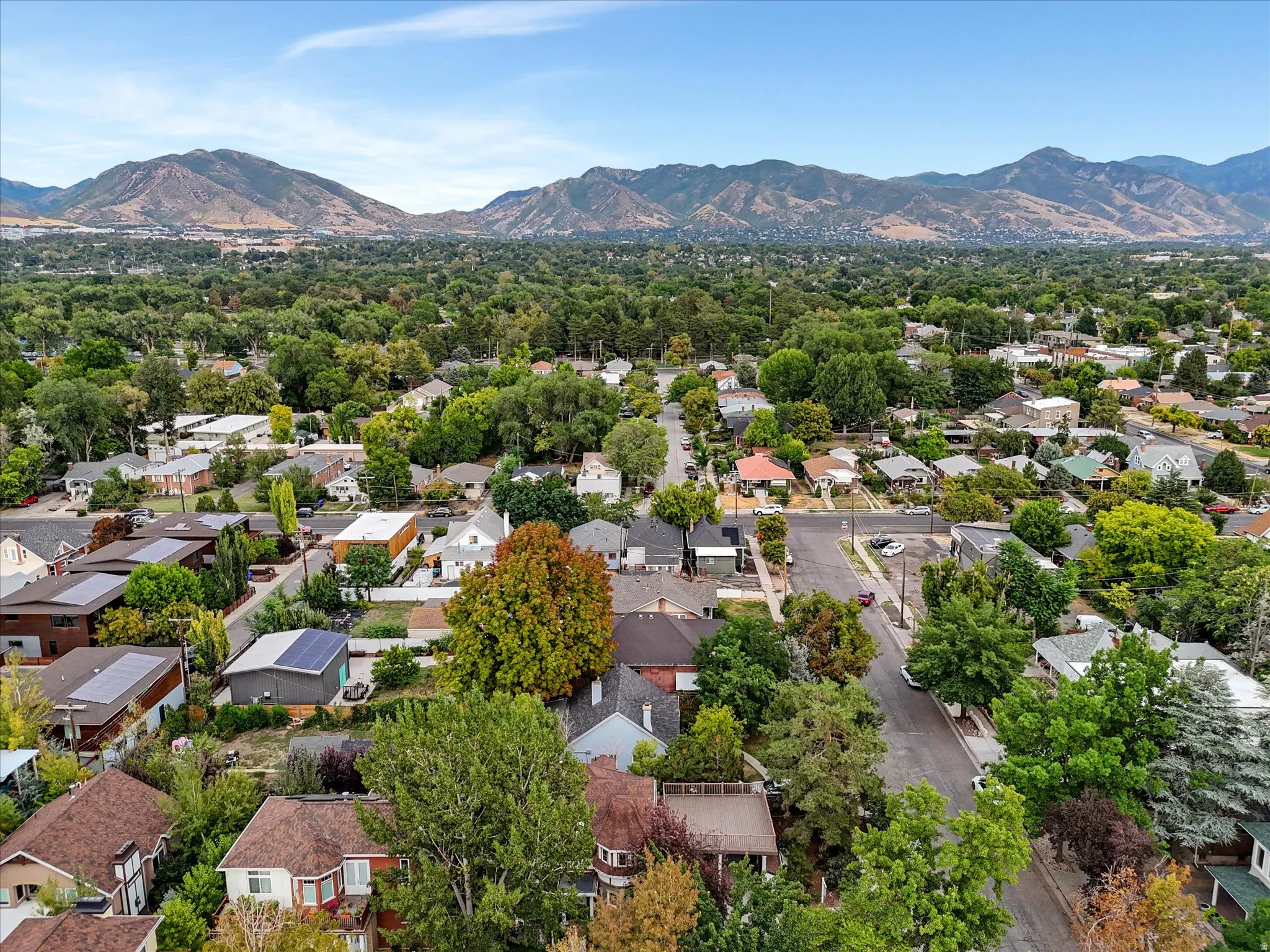 Mountain and valley views, residential neighborhood with mature trees and mountain backdrop