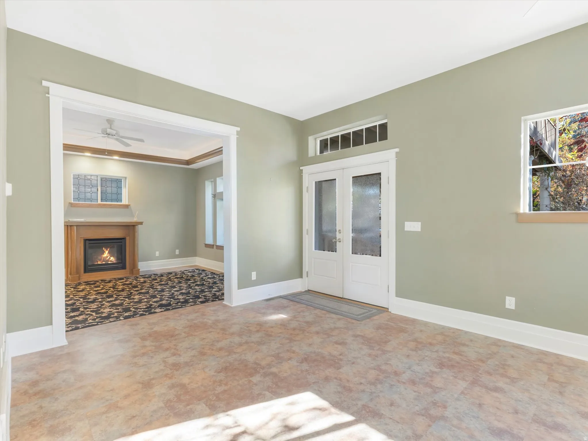 Interior with light green walls and wood-finish flooring