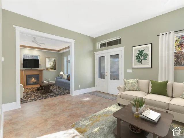 Warm-toned flooring and light green walls define this bright space