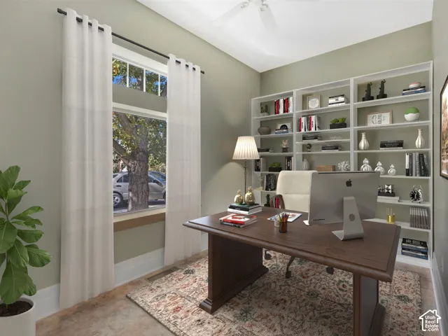 Built-in shelving, high ceilings, ceiling fan, and wood-finish flooring