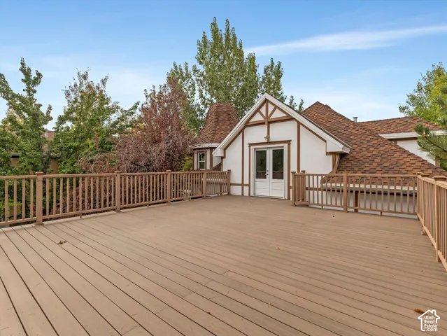 Expansive brand new deck featuring wood-look composite decking and a wood railing system
