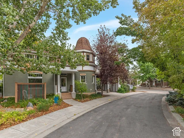 Turreted architecture with a conical roof and decorative trim
