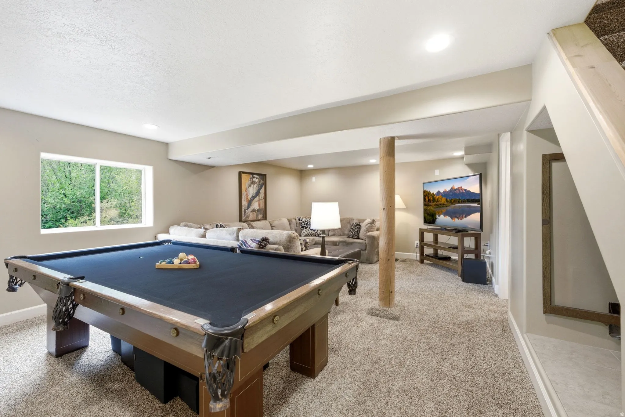 Recreational room featuring a pool table, carpeted flooring, and a window