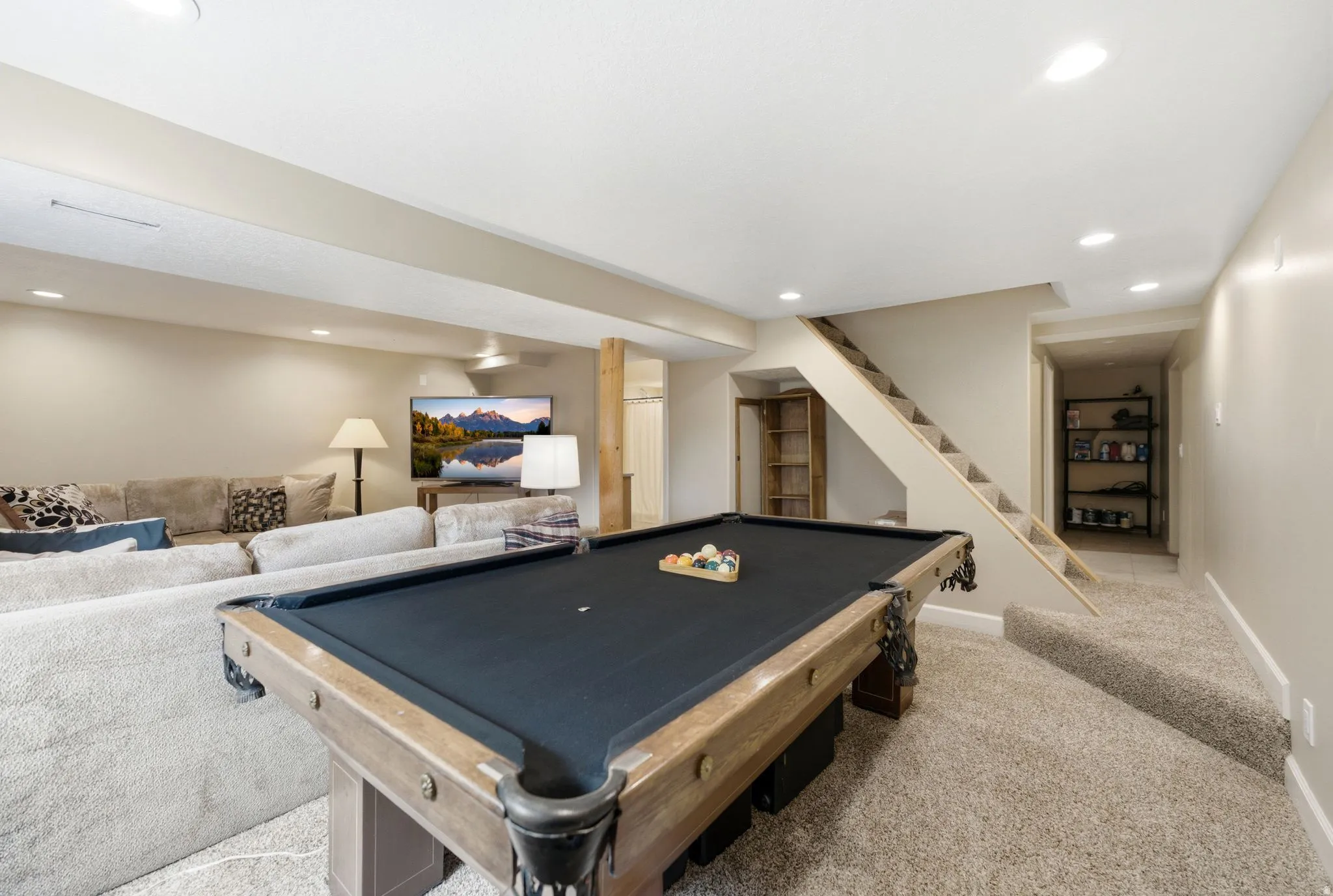 Open recreation area featuring neutral tone carpeting and recessed lighting